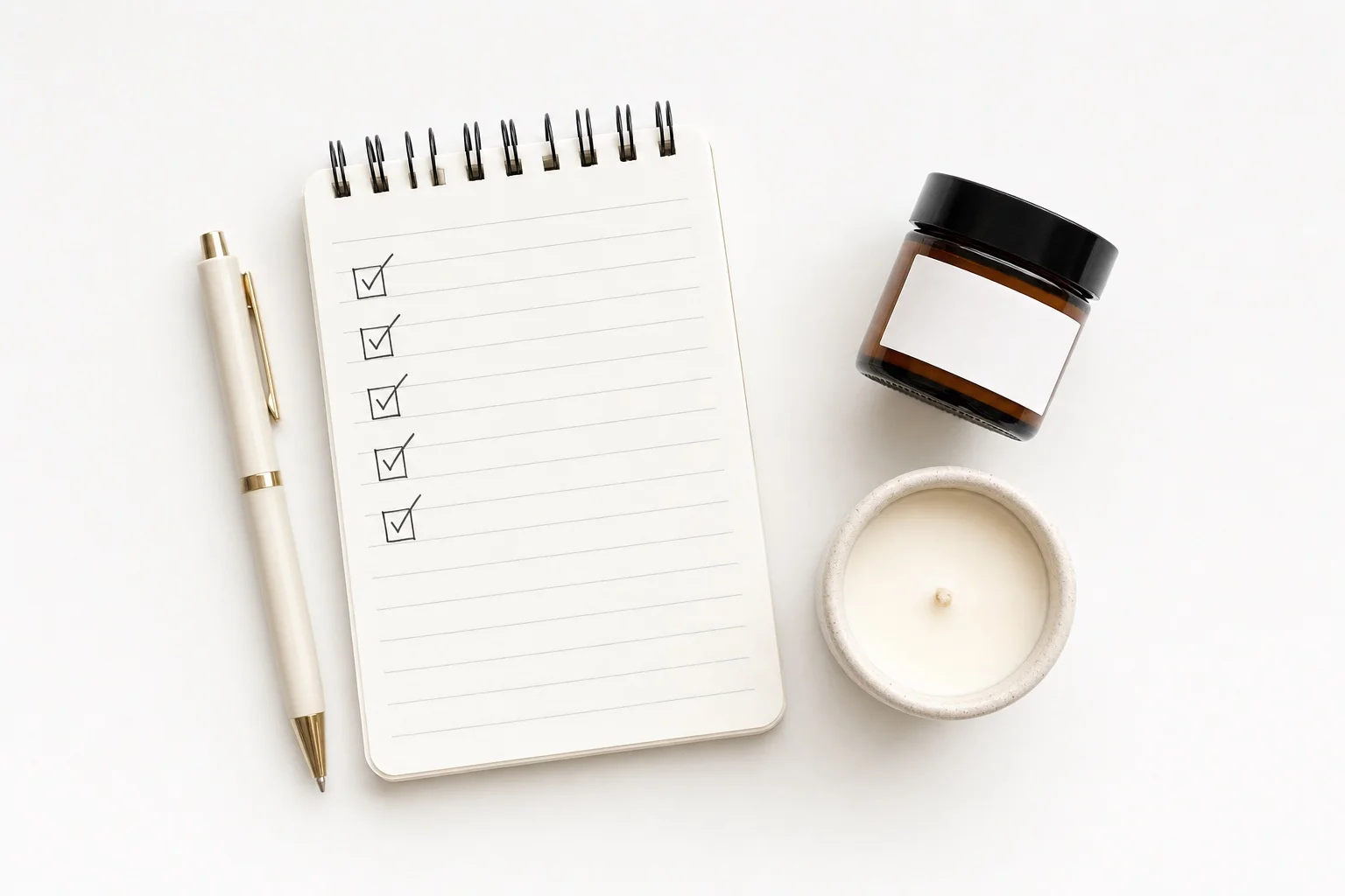 Checklist and pen flat lay representing common subscription bundle mistakes to avoid for Shopify merchants